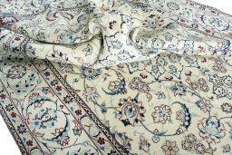 Surface texture of 2000s Nain rug with natural Wool and intricate pattern