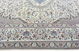 Corner detail of 2000s Nain rug showing border pattern and Wool pile