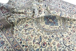 Surface texture of 2000s Nain rug with natural Wool and intricate pattern