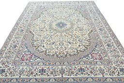 Surface texture of 2000s Nain rug with natural Wool and intricate pattern