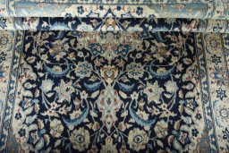 Close-up detail of 2000s Nain rug from Iran / Persia showing Wool weave