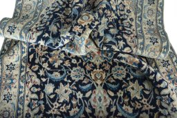 Surface texture of 2000s Nain rug with natural Wool and intricate pattern