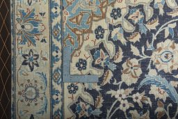 Backside of handmade 2000s Nain rug showing knot structure and weave density