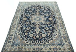 Surface texture of 2000s Nain rug with natural Wool and intricate pattern