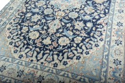 Close-up detail of 2000s Nain rug from Iran / Persia showing Wool weave