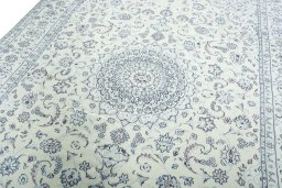 Backside of handmade New Nain rug showing knot structure and weave density