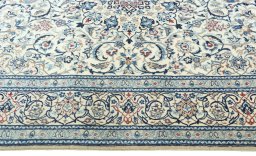 Corner detail of 2000s Nain rug showing border pattern and Cork pile
