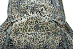 Surface texture of 2000s Nain rug with natural Cork and intricate pattern