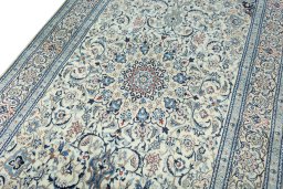 Backside of handmade 2000s Nain rug showing knot structure and weave density