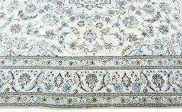 Corner detail of 2000s Nain rug showing border pattern and Wool pile