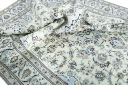 Surface texture of 2000s Nain rug with natural Wool and intricate pattern