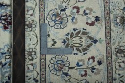 Backside of handmade 2000s Nain rug showing knot structure and weave density