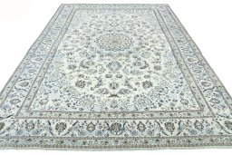 Surface texture of 2000s Nain rug with natural Wool and intricate pattern
