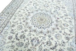 Backside of handmade 2000s Nain rug showing knot structure and weave density