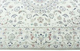 Corner detail of 2000s Nain rug showing border pattern and Wool pile