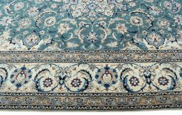 Corner detail of 2000s Nain rug showing border pattern and Wool pile