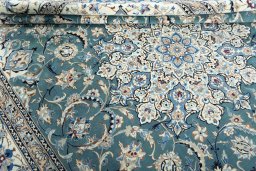 Close-up detail of 2000s Nain rug from Iran / Persia showing Wool weave