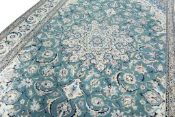 Backside of handmade 2000s Nain rug showing knot structure and weave density