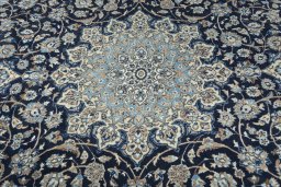 Surface texture of 2000s Nain rug with natural Wool and intricate pattern