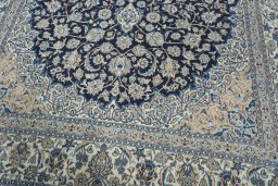 Backside of handmade 2000s Nain rug showing knot structure and weave density