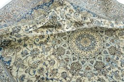 Surface texture of 2000s Nain rug with natural Wool and intricate pattern