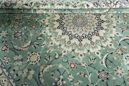 Close-up detail of 2000s Nain rug from Iran / Persia showing Wool weave