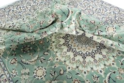 Surface texture of 2000s Nain rug with natural Wool and intricate pattern