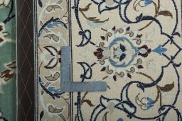 Backside of handmade 2000s Nain rug showing knot structure and weave density