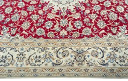 Corner detail of 2000s Nain rug showing border pattern and Wool pile