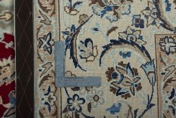 Backside of handmade 2000s Nain rug showing knot structure and weave density