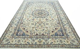Surface texture of 2000s Nain rug with natural Wool and intricate pattern