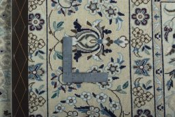Backside of handmade 2000s Nain rug showing knot structure and weave density
