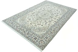 Corner detail of 2000s Nain rug showing border pattern and Wool pile