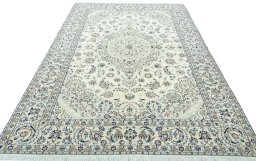 Surface texture of 2000s Nain rug with natural Wool and intricate pattern