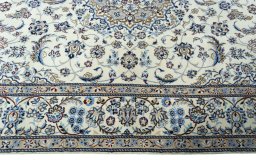 Corner detail of 2000s Nain rug showing border pattern and Wool pile
