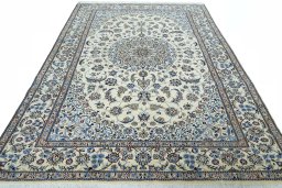 Surface texture of 2000s Nain rug with natural Wool and intricate pattern