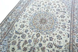 Backside of handmade 2000s Nain rug showing knot structure and weave density