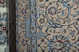 Backside of handmade 2000s Nain rug showing knot structure and weave density