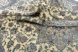 Surface texture of 2000s Nain rug with natural Wool and intricate pattern