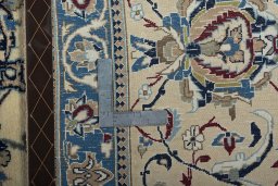 Backside of handmade 2000s Nain rug showing knot structure and weave density