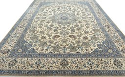 Surface texture of 2000s Nain rug with natural Wool and intricate pattern