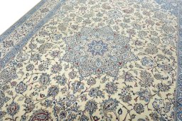 Backside of handmade 2000s Nain rug showing knot structure and weave density