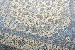 Close-up detail of 2000s Nain rug from Iran / Persia showing Wool weave