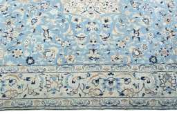 Corner detail of 2000s Nain rug showing border pattern and Wool pile