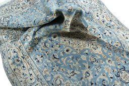 Surface texture of 2000s Nain rug with natural Wool and intricate pattern