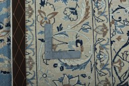 Backside of handmade 2000s Nain rug showing knot structure and weave density