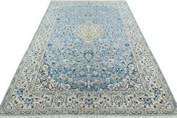 Surface texture of 2000s Nain rug with natural Wool and intricate pattern