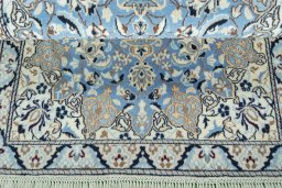 Corner detail of 2000s Nain rug showing border pattern and Wool pile