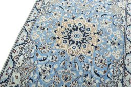 Backside of handmade 2000s Nain rug showing knot structure and weave density