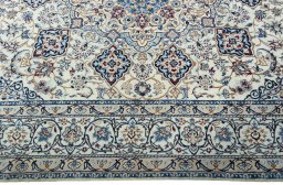 Corner detail of New Nain rug showing border pattern and Wool pile